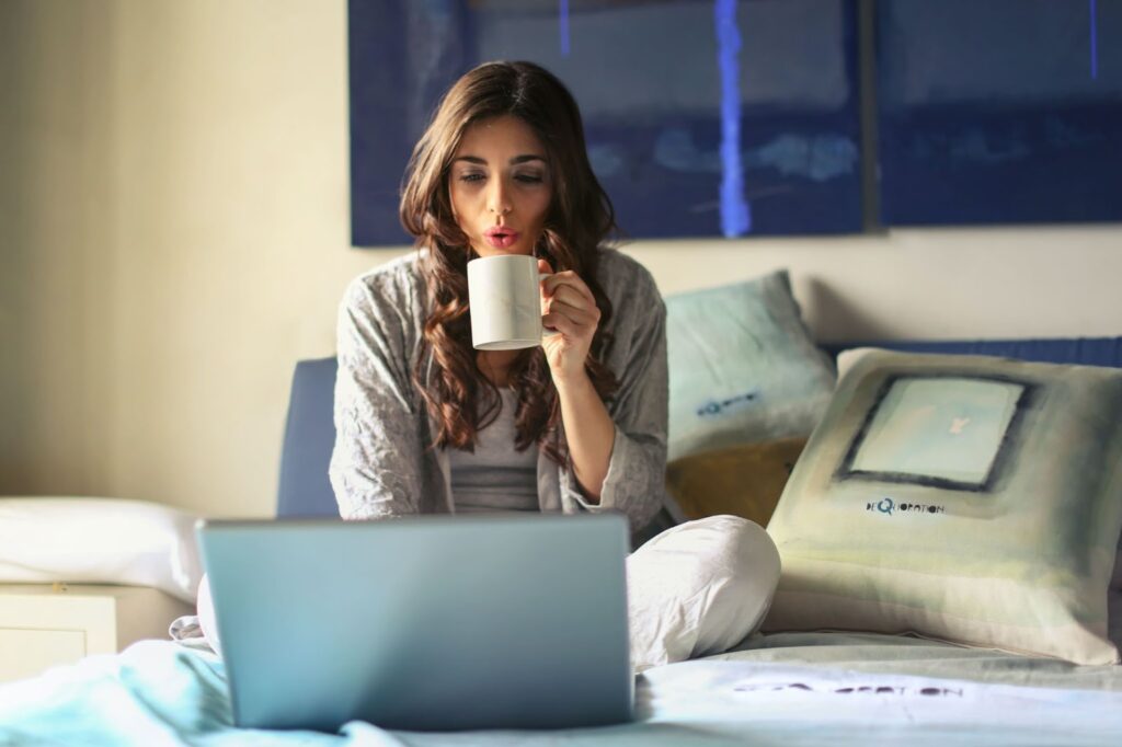 girl drinking coffee and working