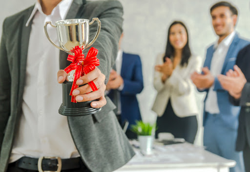 man holding a trophy