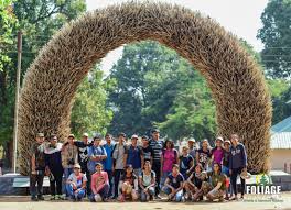 Foliage Outdoors 0 a large group of students posing for a group photo in front of an arc