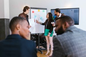 a woman Pitching innovative ideas to potential investors