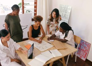 A group of social entrepreneurs collaborating in a startup accelerator program