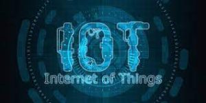 A blue surface displaying the abbreviation 'IoT' in clear white text.