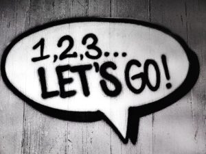 A speech bubble with the words "let's go" written inside it.