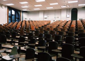 Empty chairs in a lecture hall, awaiting eager minds.