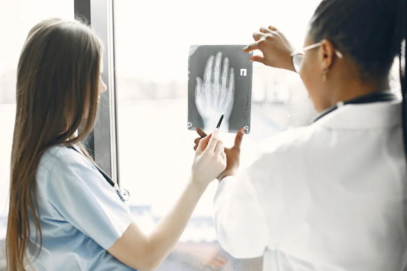 a doctor and a patient discussing a hand x-ray